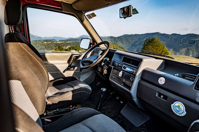 Front seats in VW T4 Campervan with roof tent from Balkan Campers in Tolmin, Slovenia