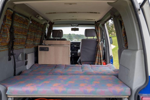 Bedroom inside of VW T4 campervan From Balkan Campers in Ljubljana, Slovenia