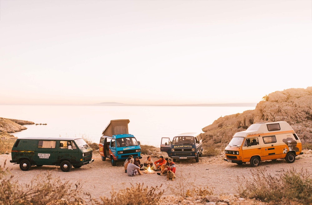 Four Balkan Campers T3 campervans parked on a beach on Krk Island in Croatia