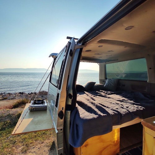 Bed and Kitchen in VW T4 Camper van from Balkan Campers in Rabac, Croatia