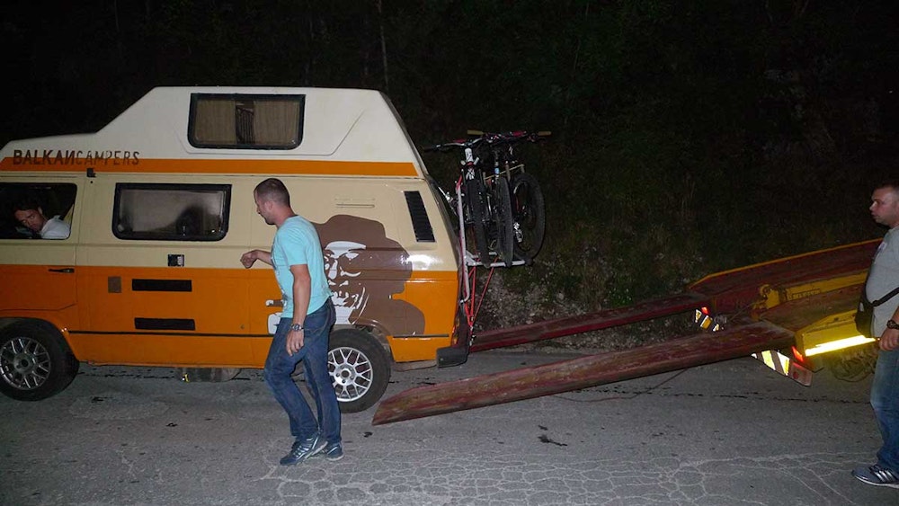 Stepan loading Grga campervan to a towing truck