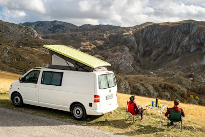 A couple with VW bus from Balkan Campers, free camping in Durmitor National Park, Montenegro
