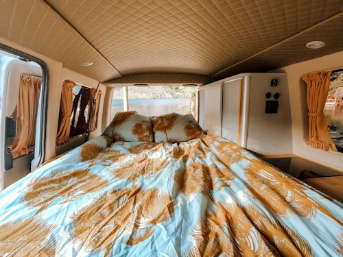 Bed in VW T6 automatic Campervan from Balkan Campers at Lake Bohinj, Slovenia