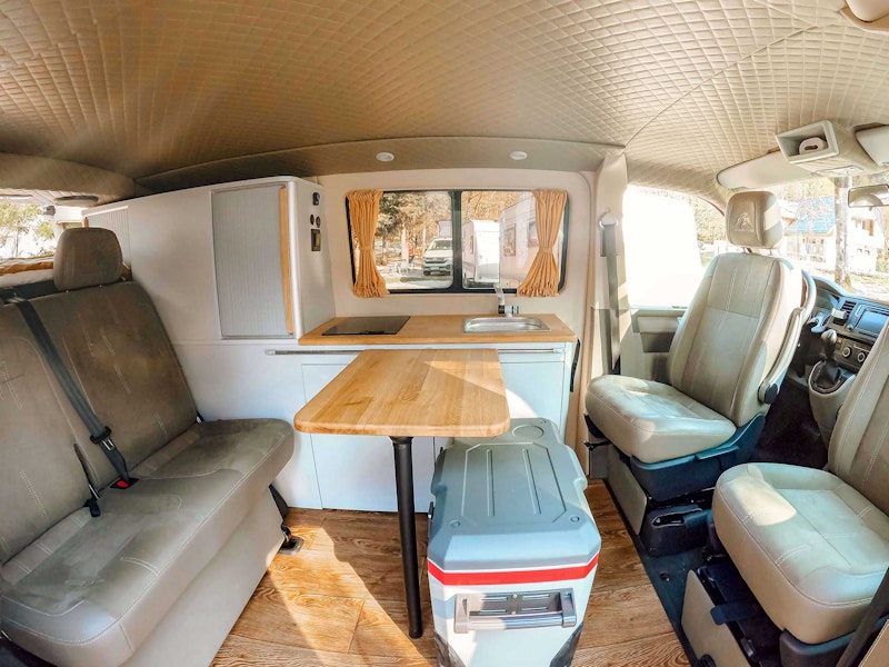 Living space inside VW T6 automatic Campervan from Balkan Campers at Lake Bohinj, Slovenia
