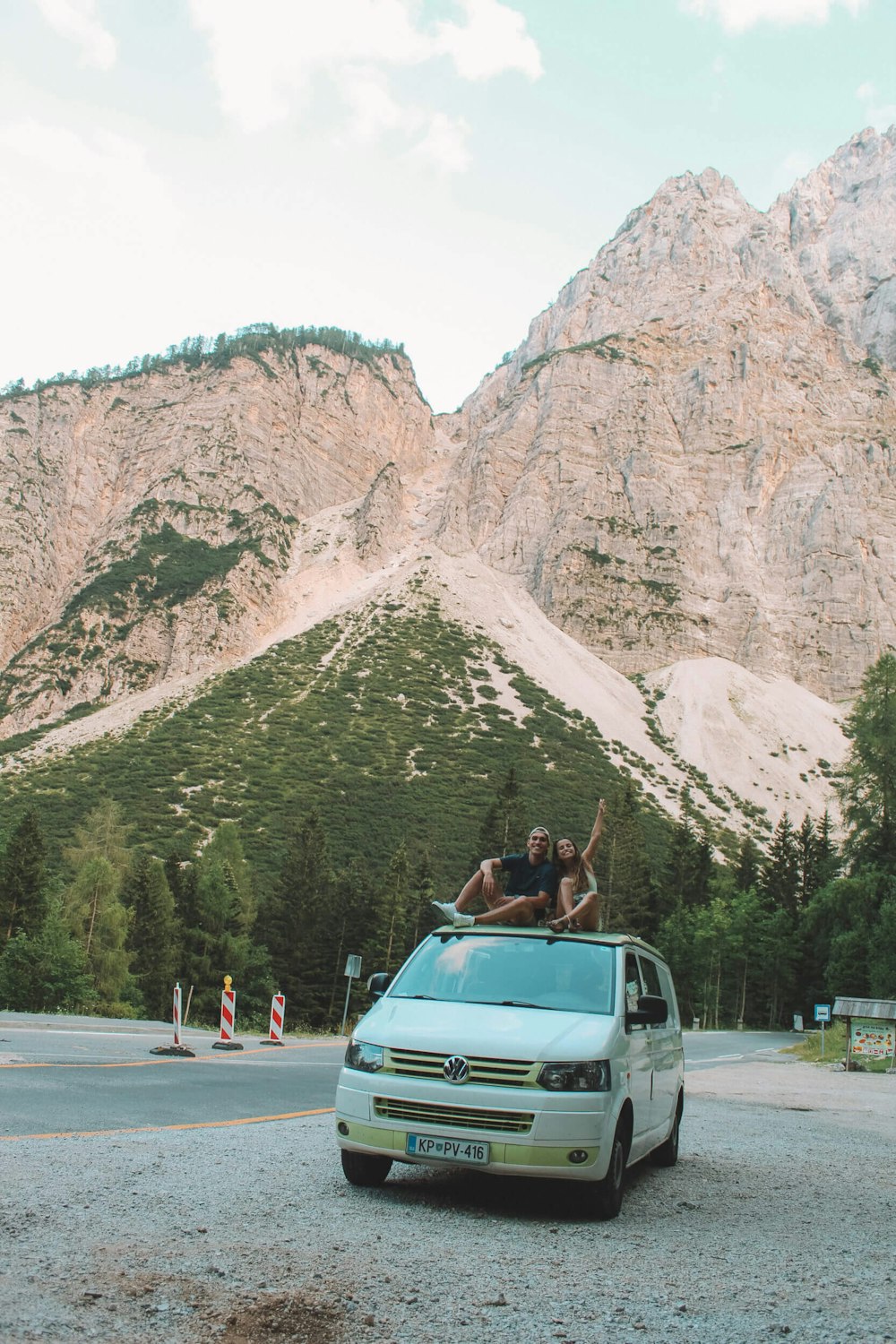 Balkan CAmpers customers in VW T5 camper van on the top of Vršič Pass, Slovenia