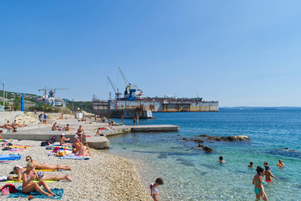 Balkan Campers customers on a beach in Rijeka, Slovenia