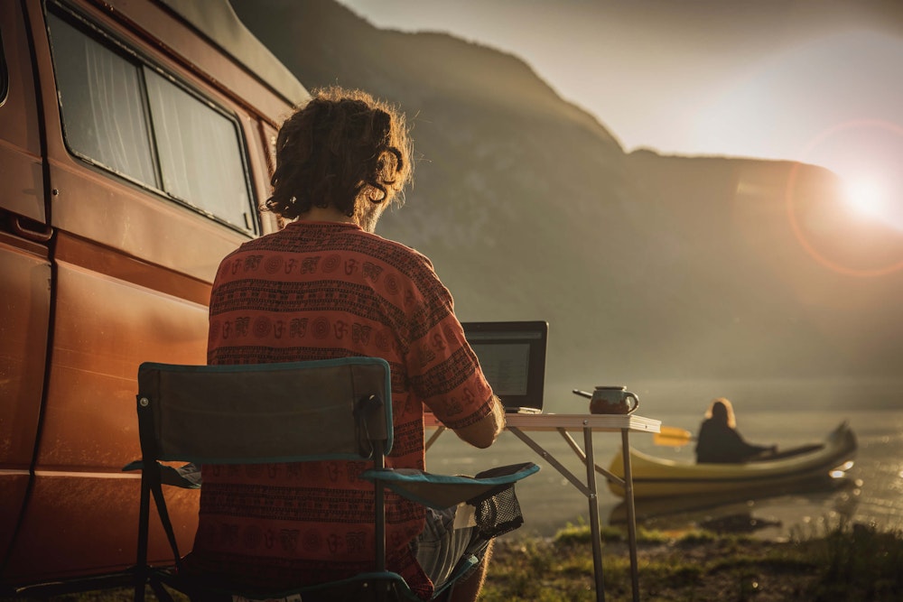 Balkan Campers customers with VW T3 Camper van working in Bohinj, Slovenia