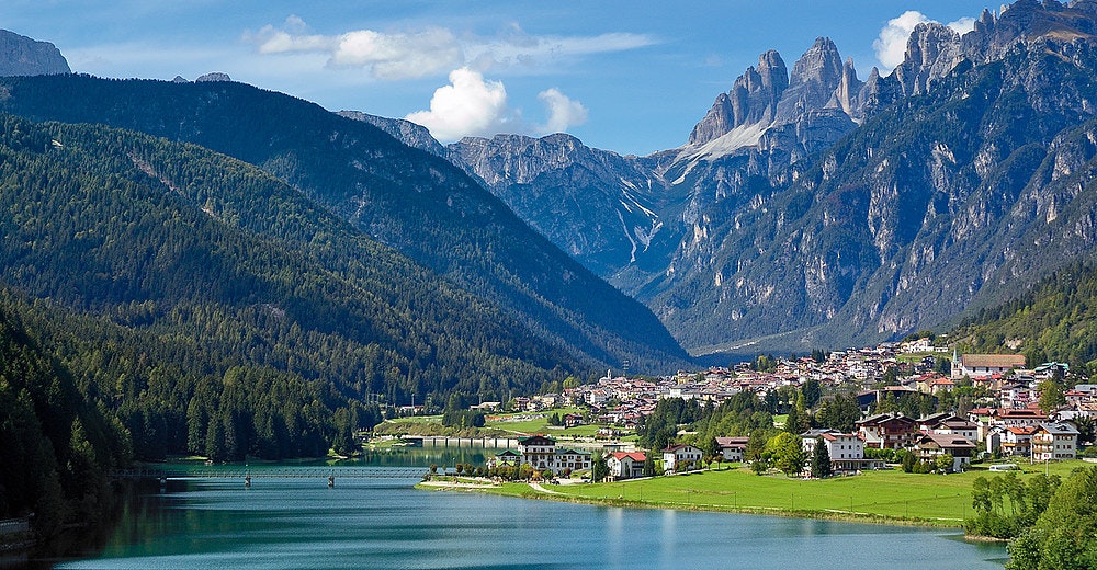 Beautiful town at the lake in Italian Dolomites