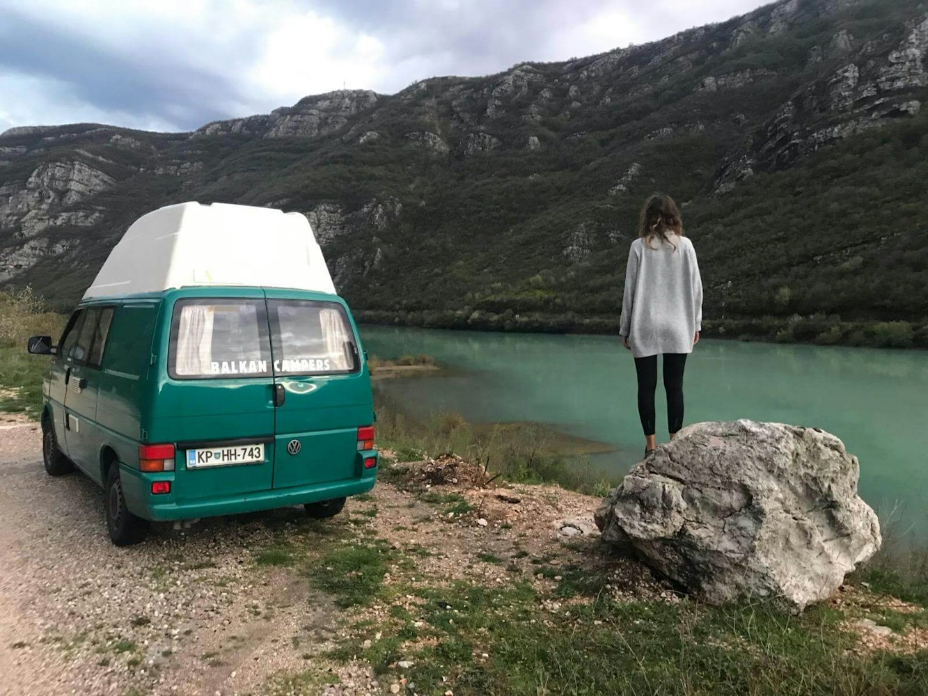 VW T4 parked next to the green Neretva river