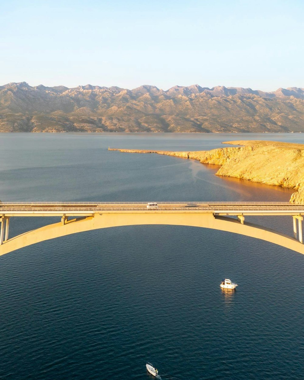 Campervan at a 300 m (980 ft) long arch bridge connects the southern part of the island Pag to the mainland.