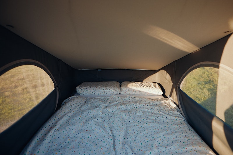 Cosy upper bedroom in VW California Balkan Campers