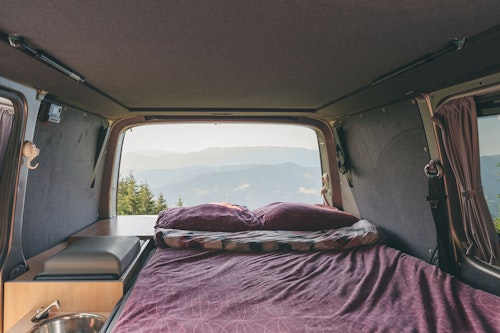 Cosy bedroom in VW T6 from Balkan Campers