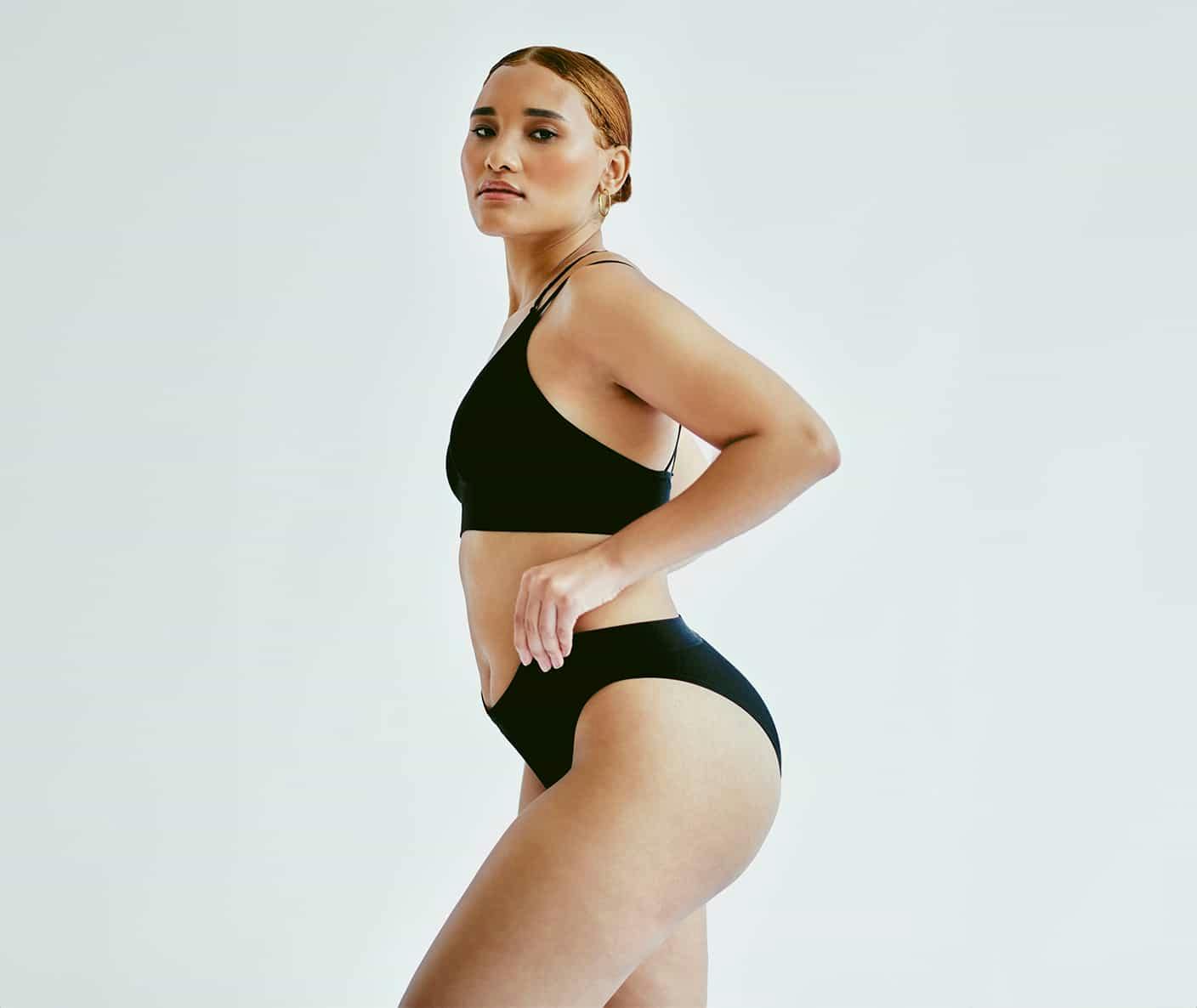 Woman posing in black underwear