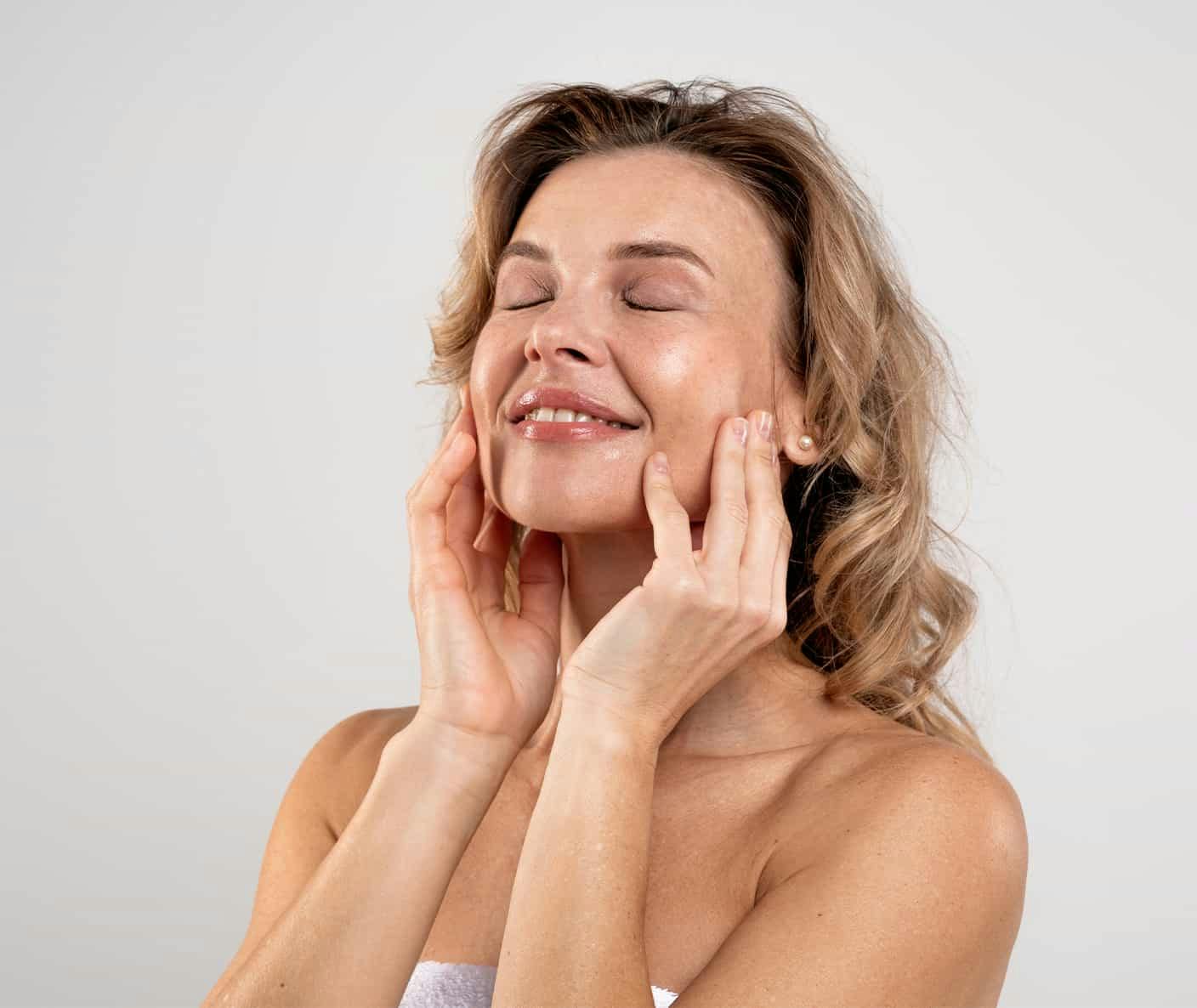 Woman touching face smmiling