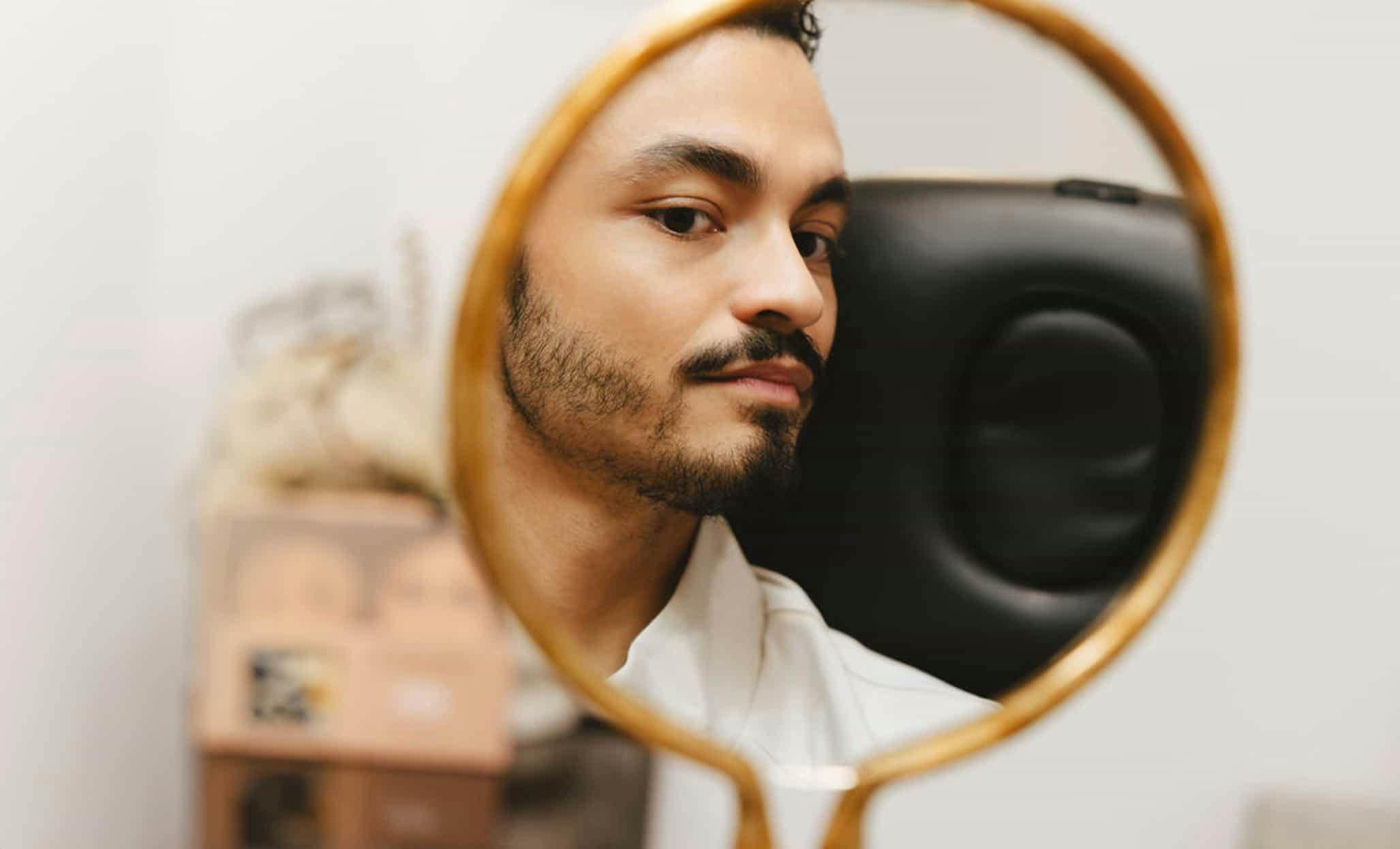 Man looking in the mirror