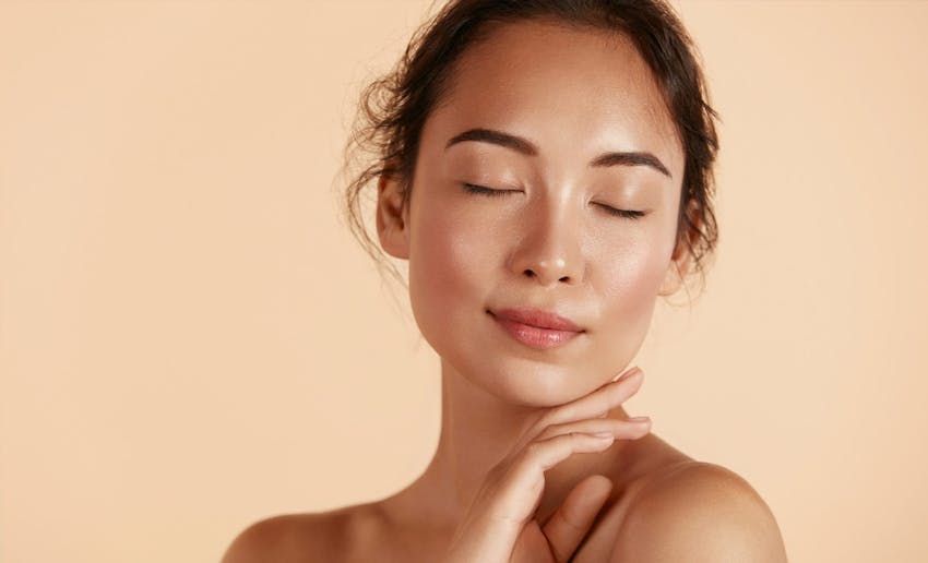 Woman resting fingers on chin