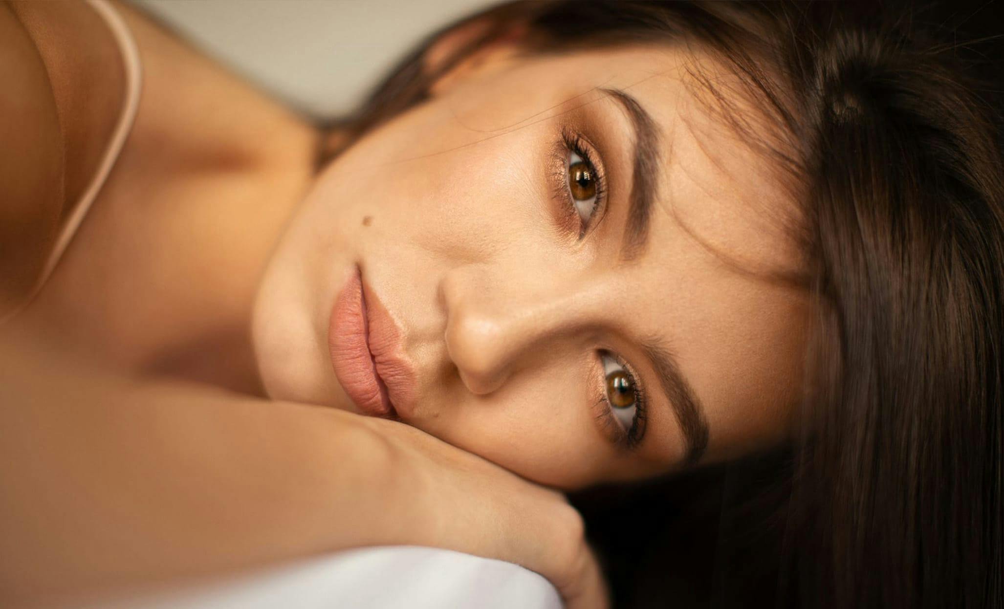 woman resting head on hand