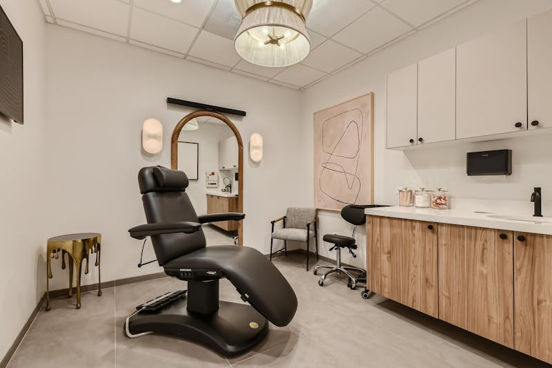 View of treatment room with black chair