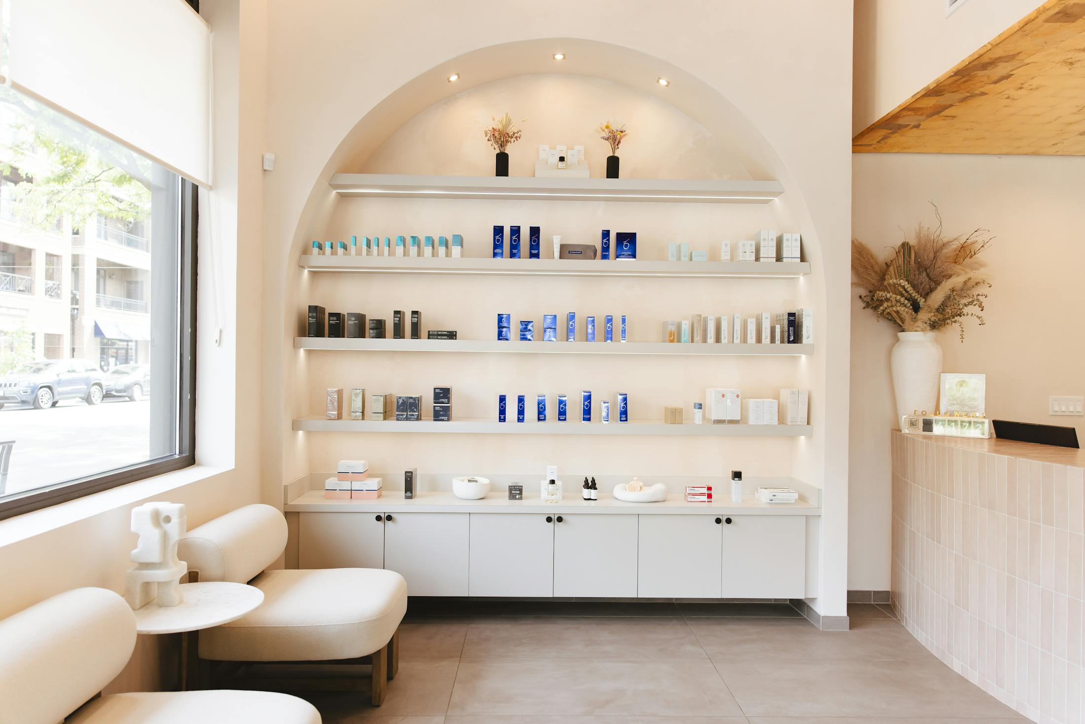 wall of skincare items offered at Fulcrum Aesthetics