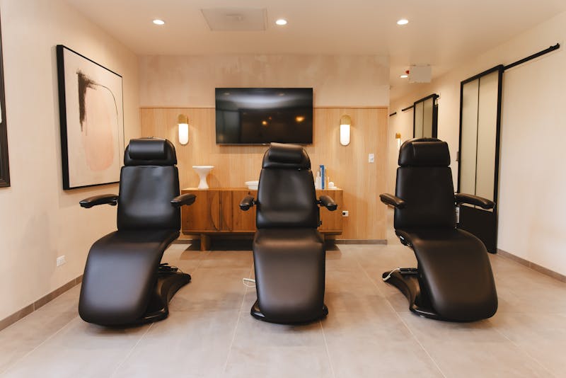 three black client treatment chairs