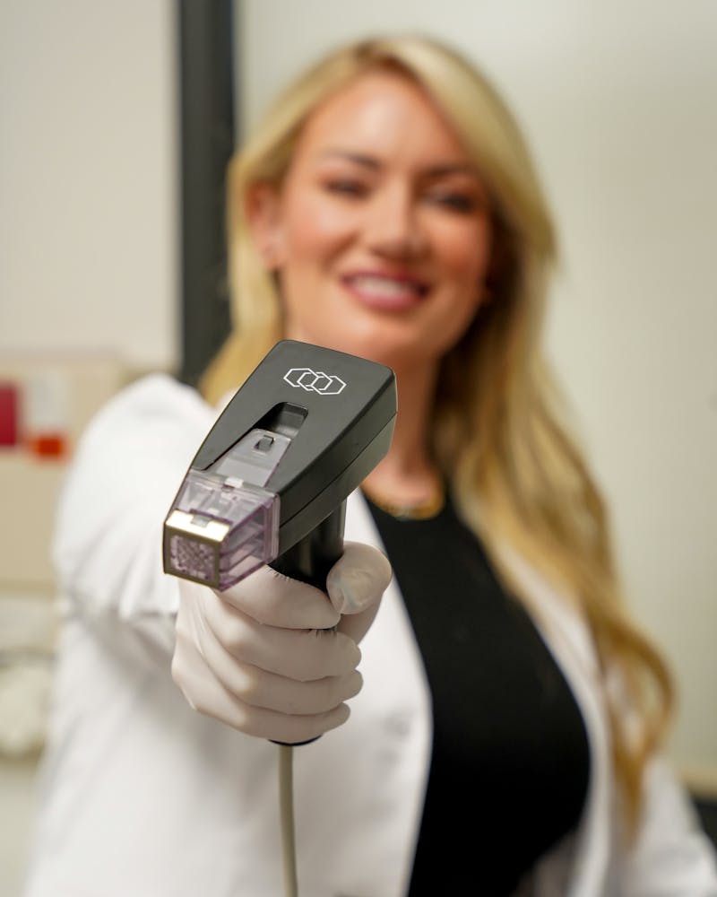 Brittony Croasdell with handpiece tool in foreground