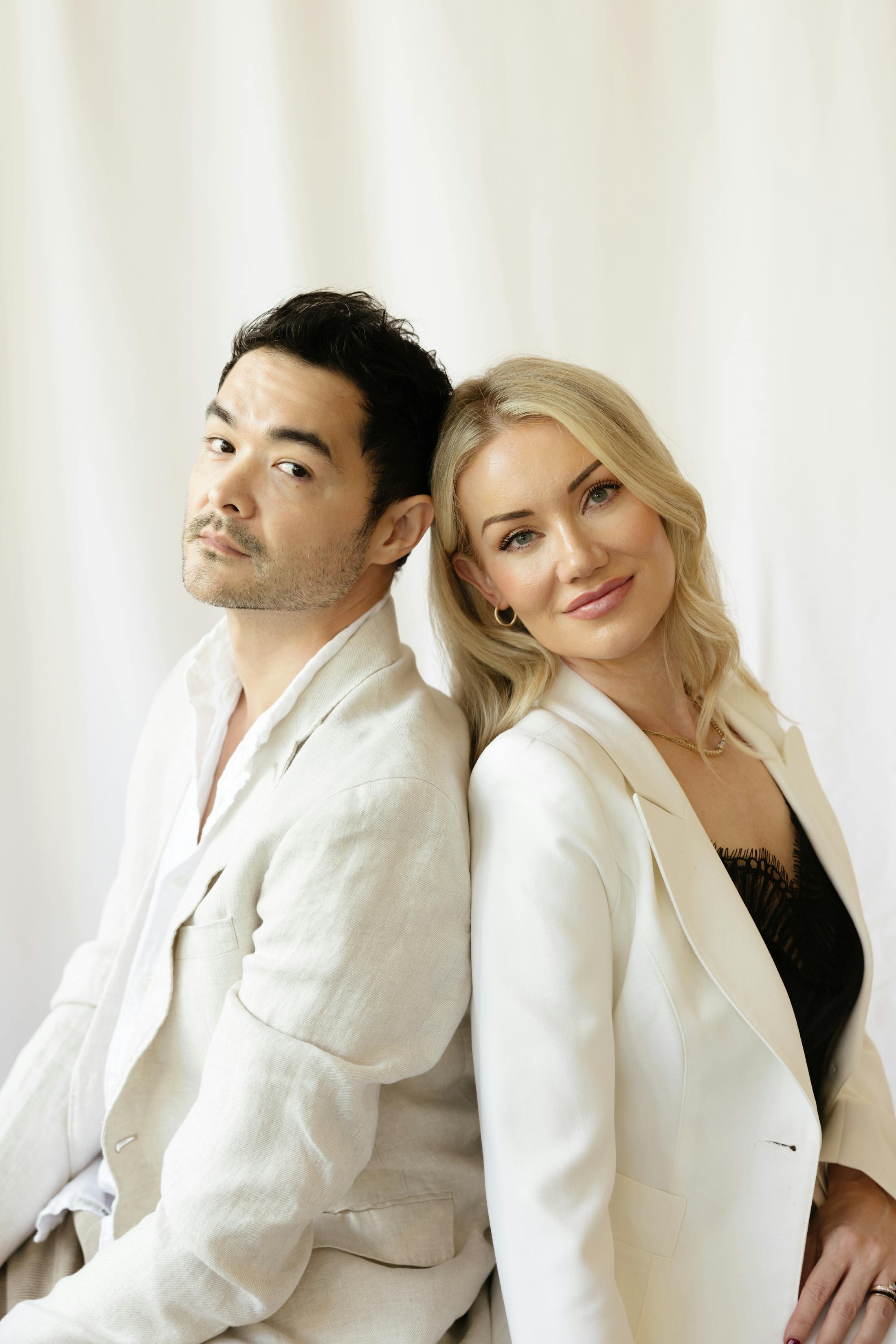 Dr. David Hill, MD and Brittony Croasdell sitting back to back