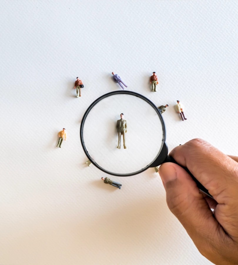 Creative image of people under a microscope.
