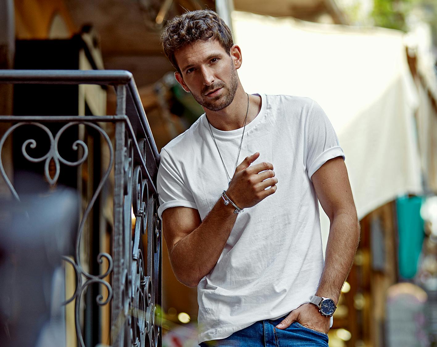 Man leaning against a railing