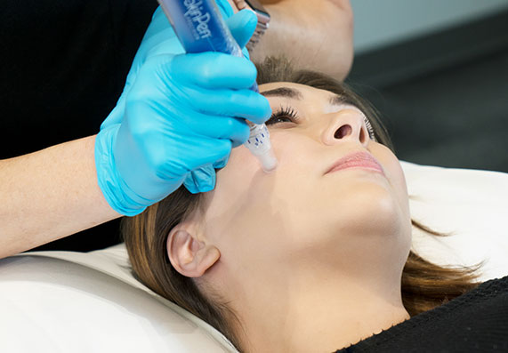 Woman getting facial treatment