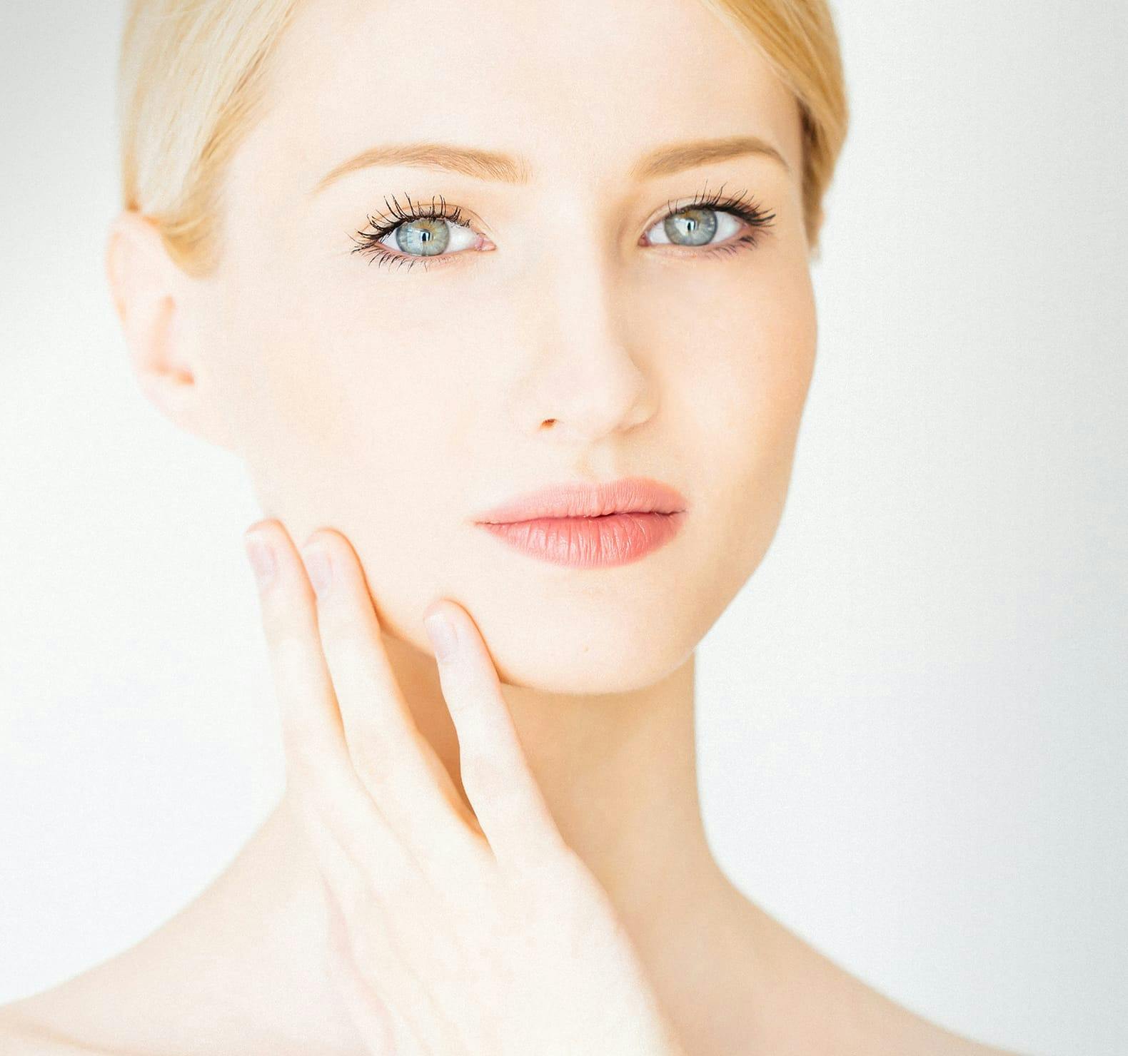 Woman touching face