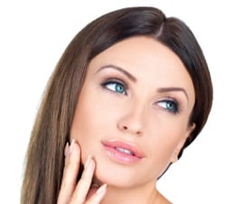 woman touching her face