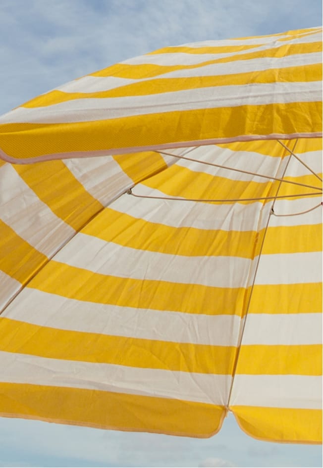 yellow and white striped umbrella