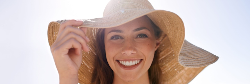 woman with hat blocking the sun