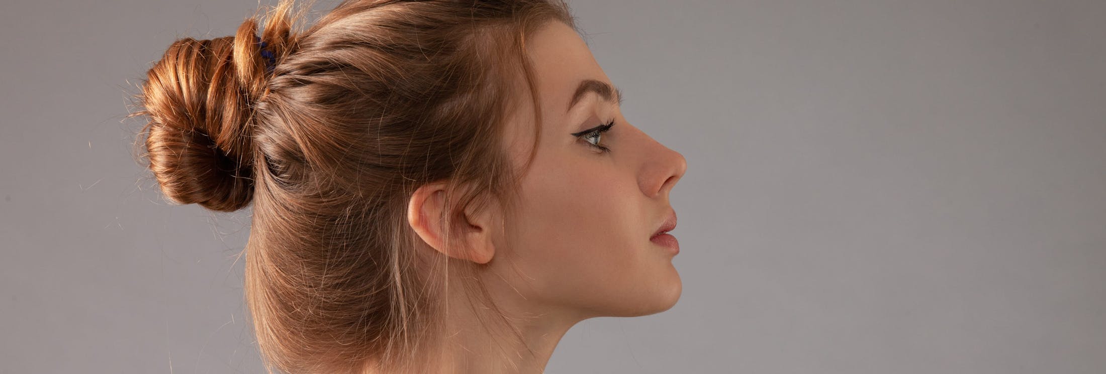 woman with bun in hair side angle