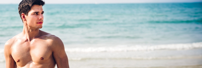 man on beach looking to the side
