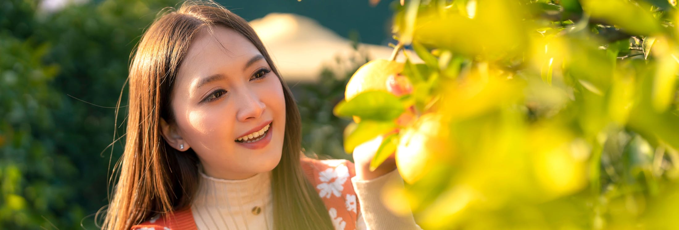 woman looking at lemon