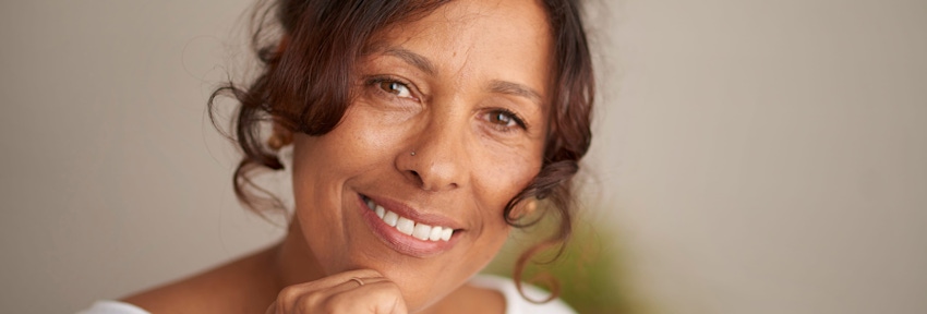 older woman looking forward and smiling