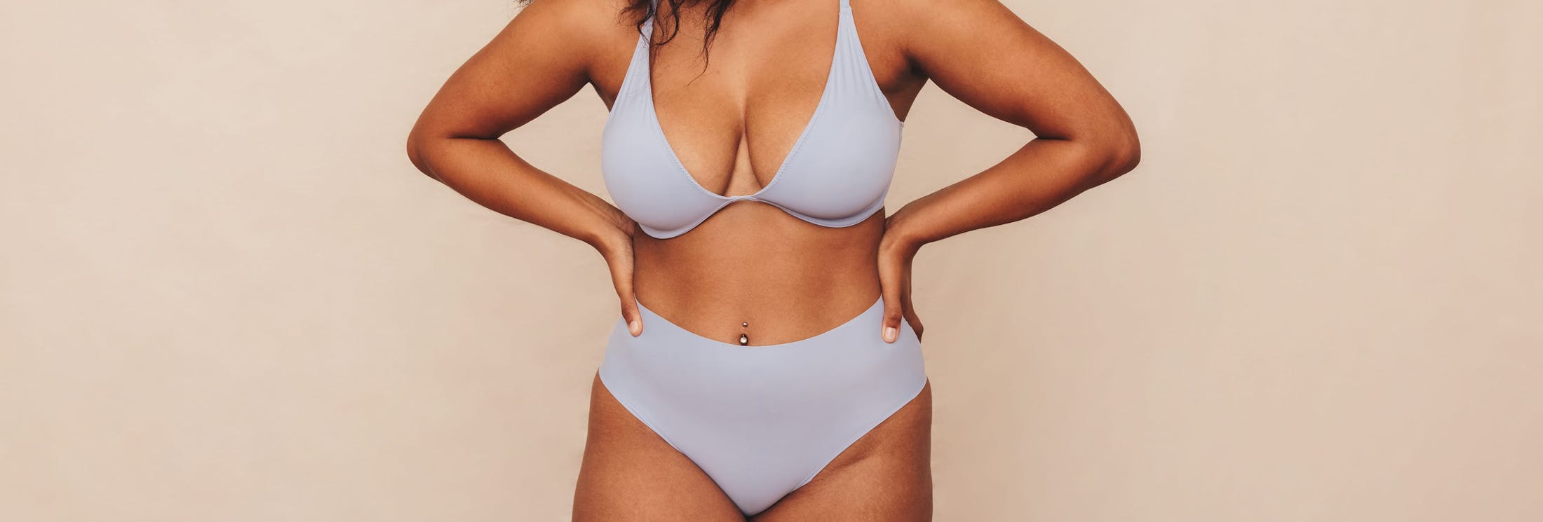 woman's body with hands on her hips