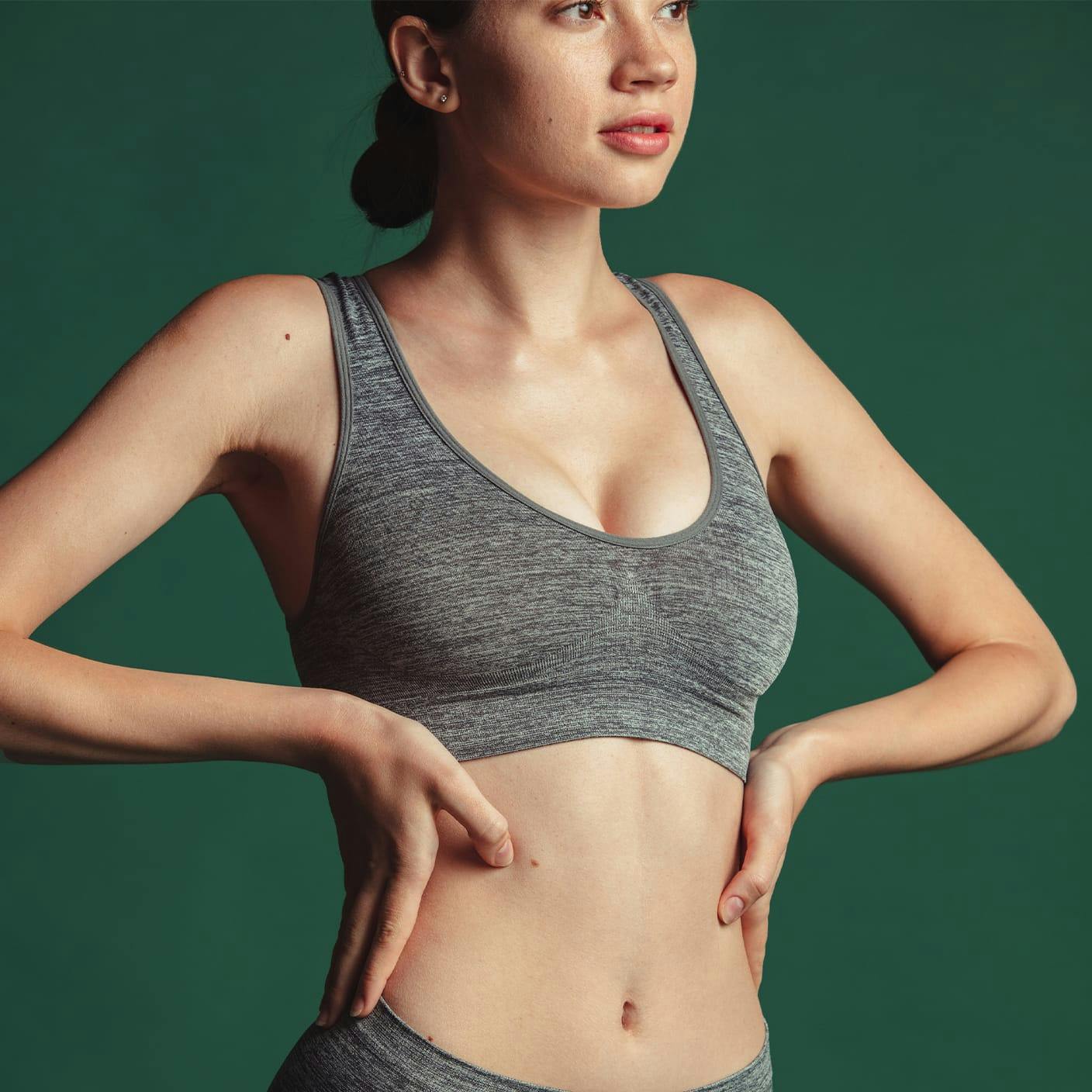 woman wearing a grey sports bra