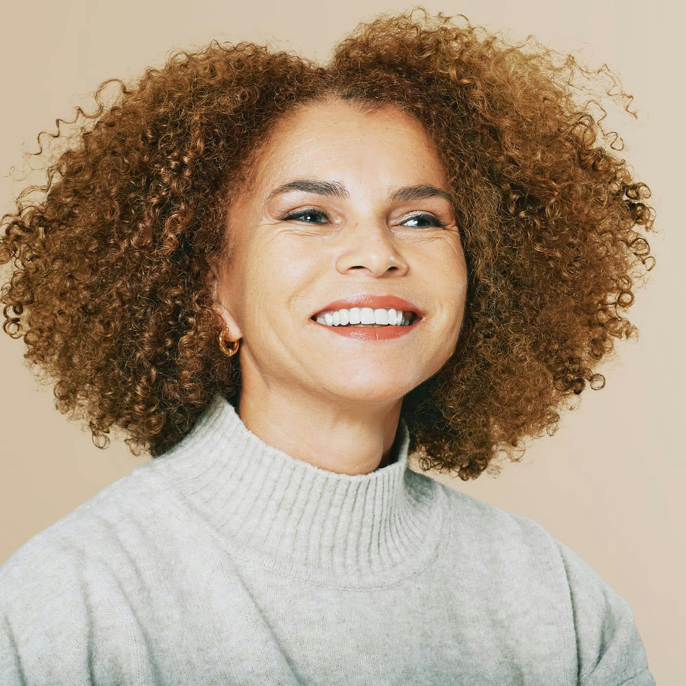 woman with very curly shoulder length hair