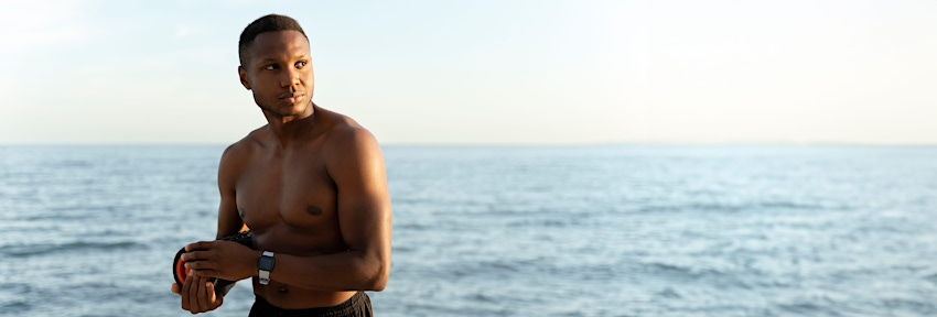 woman laying on her side by the edge of the pool