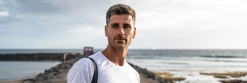 older woman in red tanktop looking forward