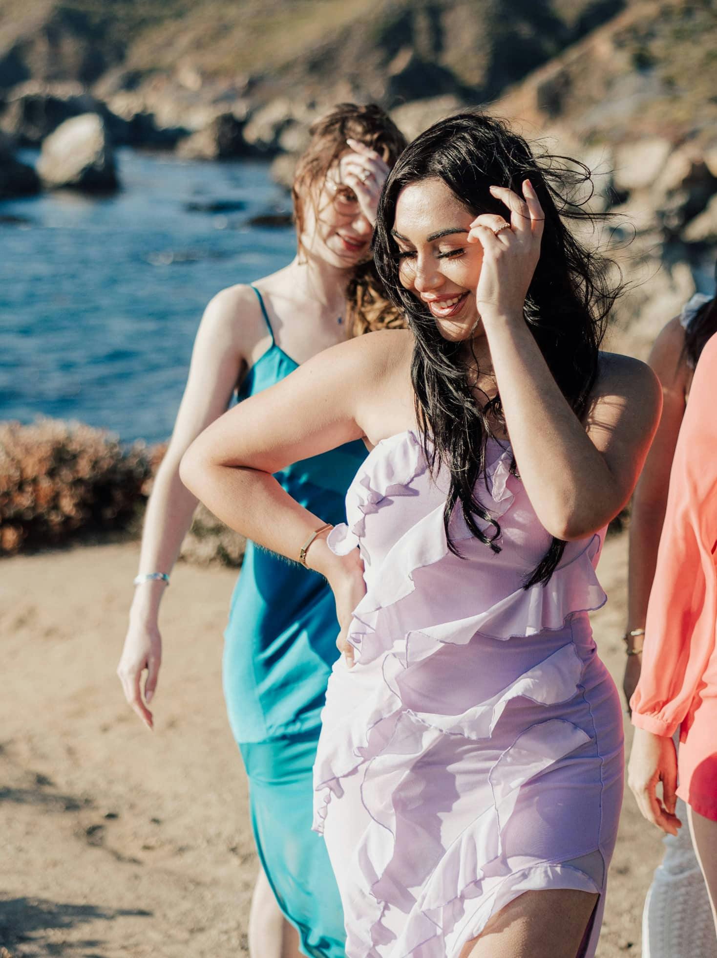 Women Smiling and walking down the beach