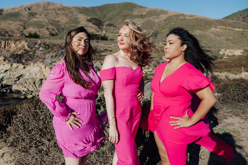 Woman wearing pink posing for picture