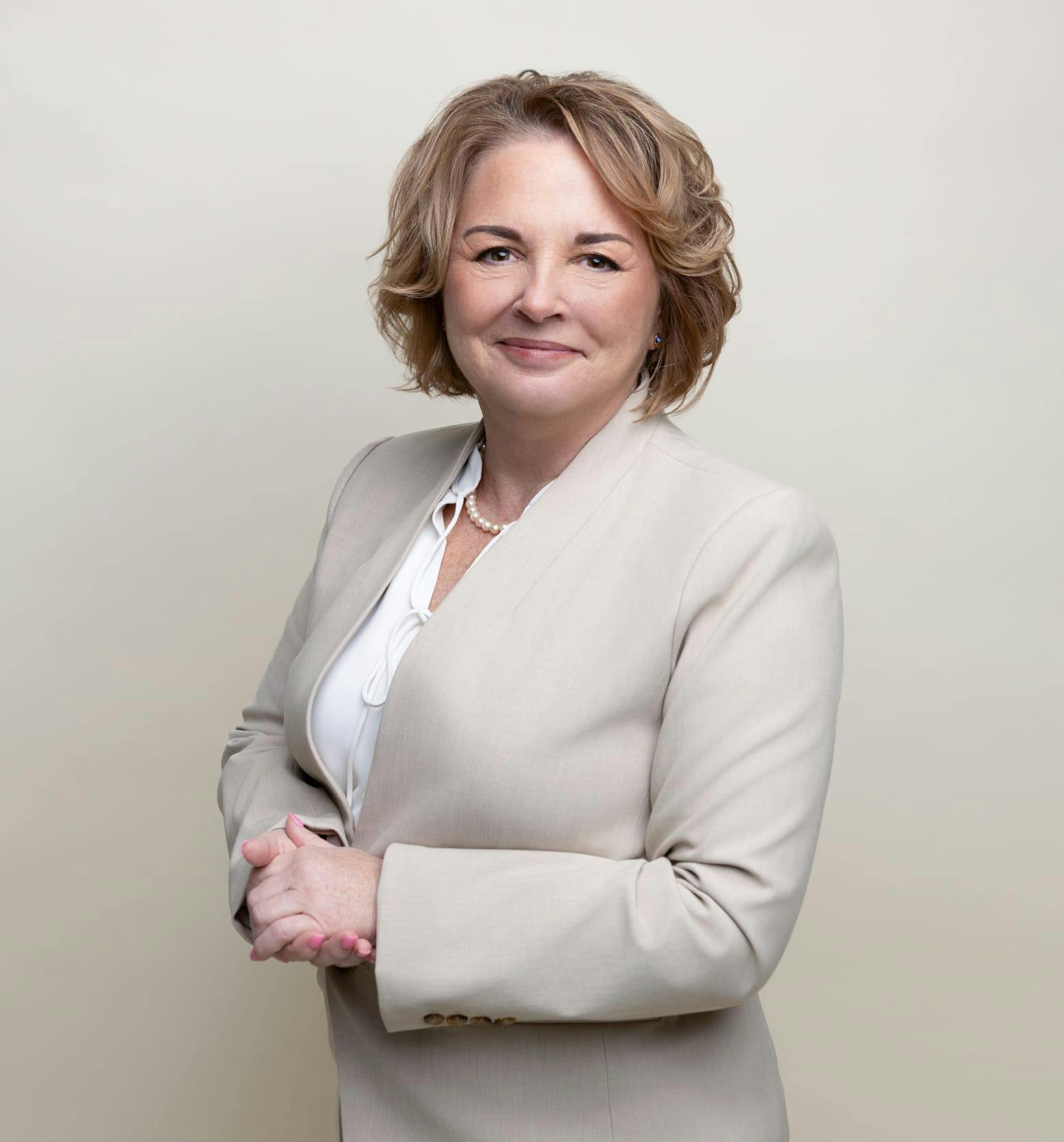 Woman in a tan jacket