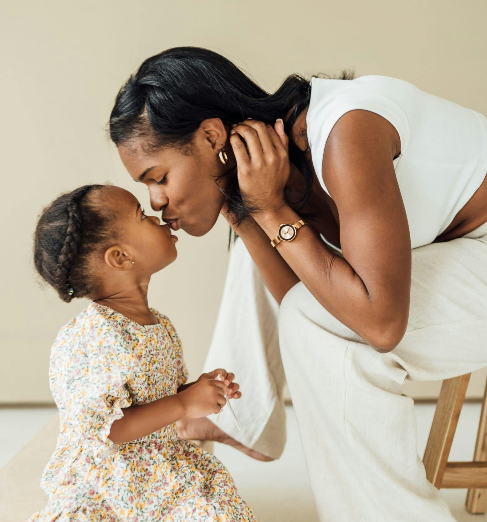 Woman kissing her daughter