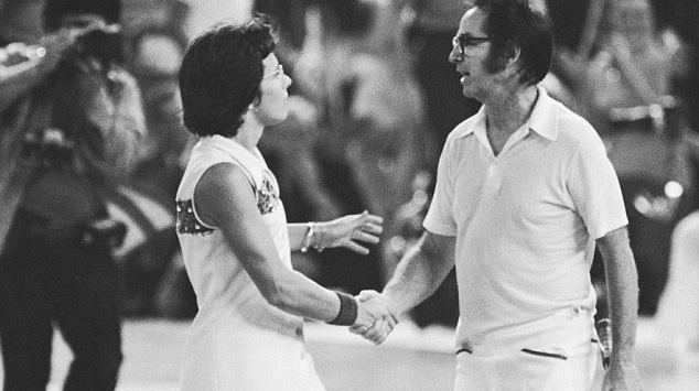 man and woman at tennis match shaking hands