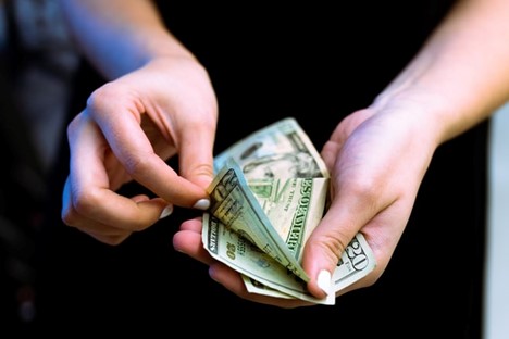 person counting money 