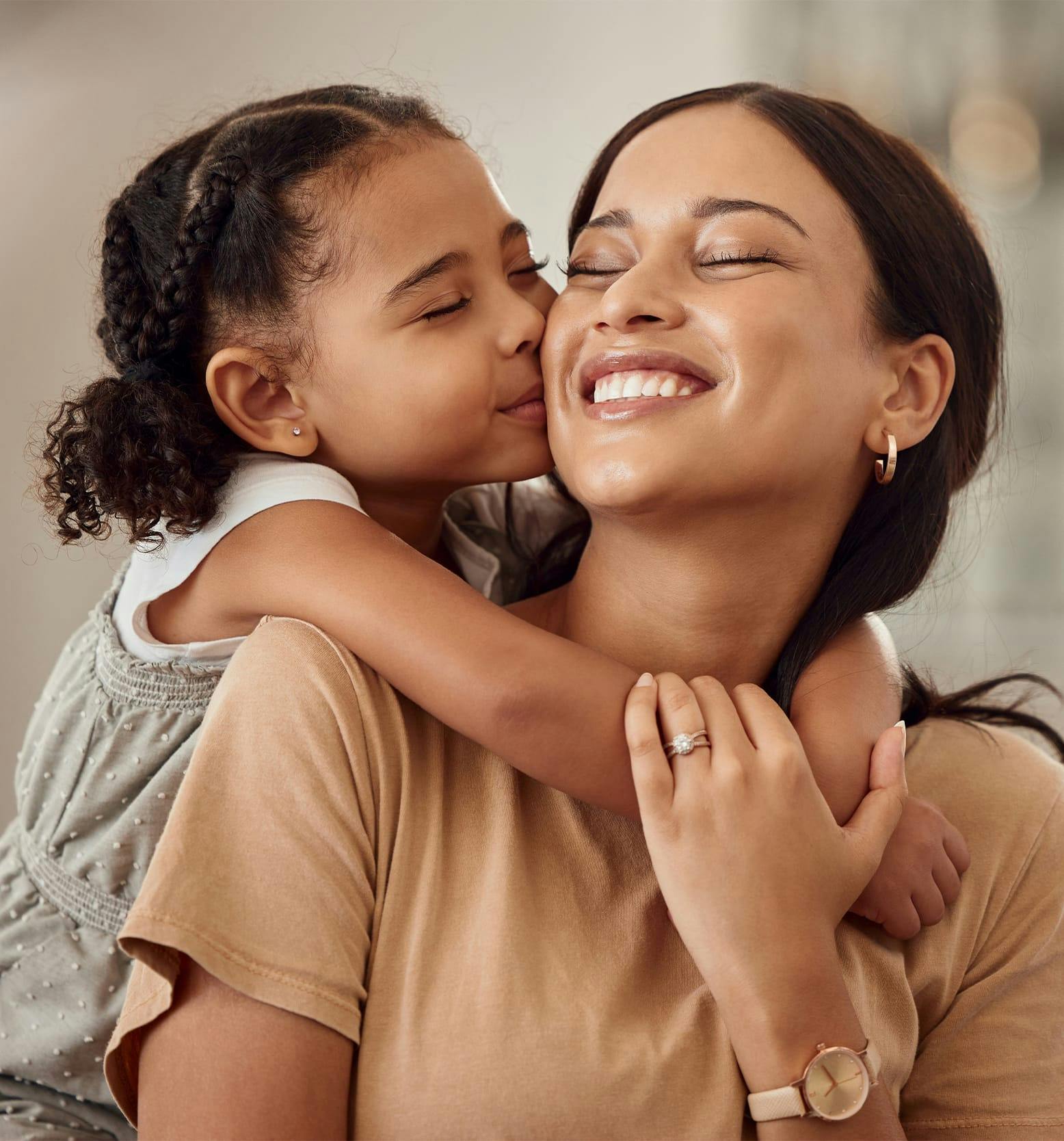 daughter kissing mom's cheek