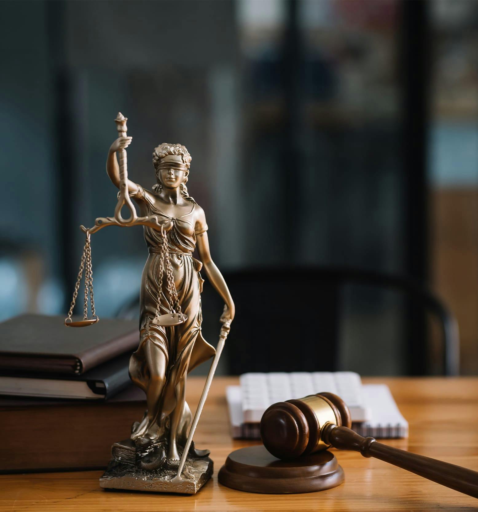 statue next to judge gavel